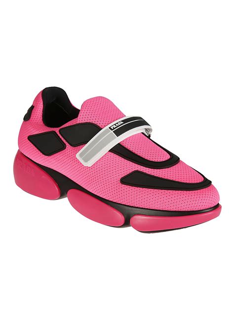 pink and white Prada sneakers